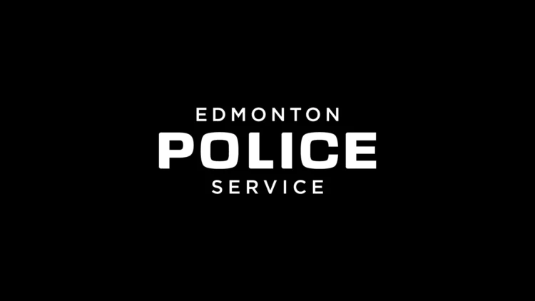 white Edmonton police service logo on black background