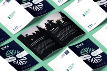 Copies Of The SACE Rooted Indigenous Booklet Open To The Centre Of The Booklet And The Front And Back Covers Tiled Out On A Mint Green Background.