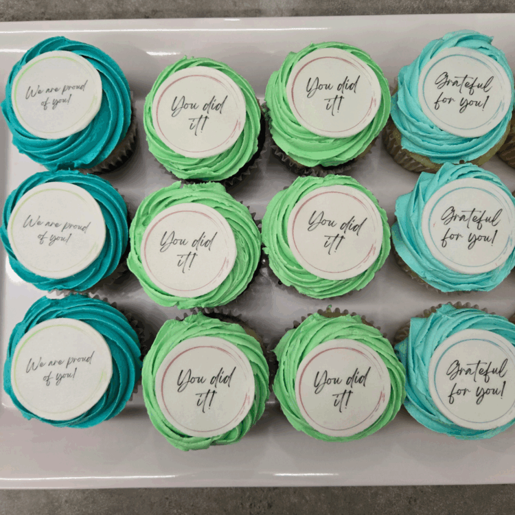 Teal and mint cupcakes that say "We are proud of you!", "You did it!", and "Grateful for you!" Intended to show appreciation to SACE volunteers