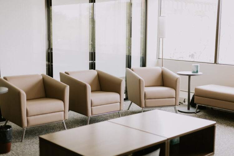 a closeup of three comfy chairs in the SACE group counselling room.