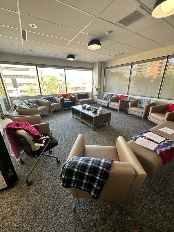 Wiwip'son Group Room comfy chairs arranged in a circle with pillows and blankets